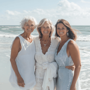 Three generations of women on the beach representing family wellness and holistic healing support